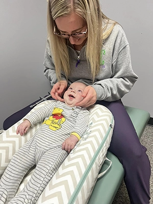 Chiropractor Chippewa Falls WI Kristin Wahl Adjusting Infant